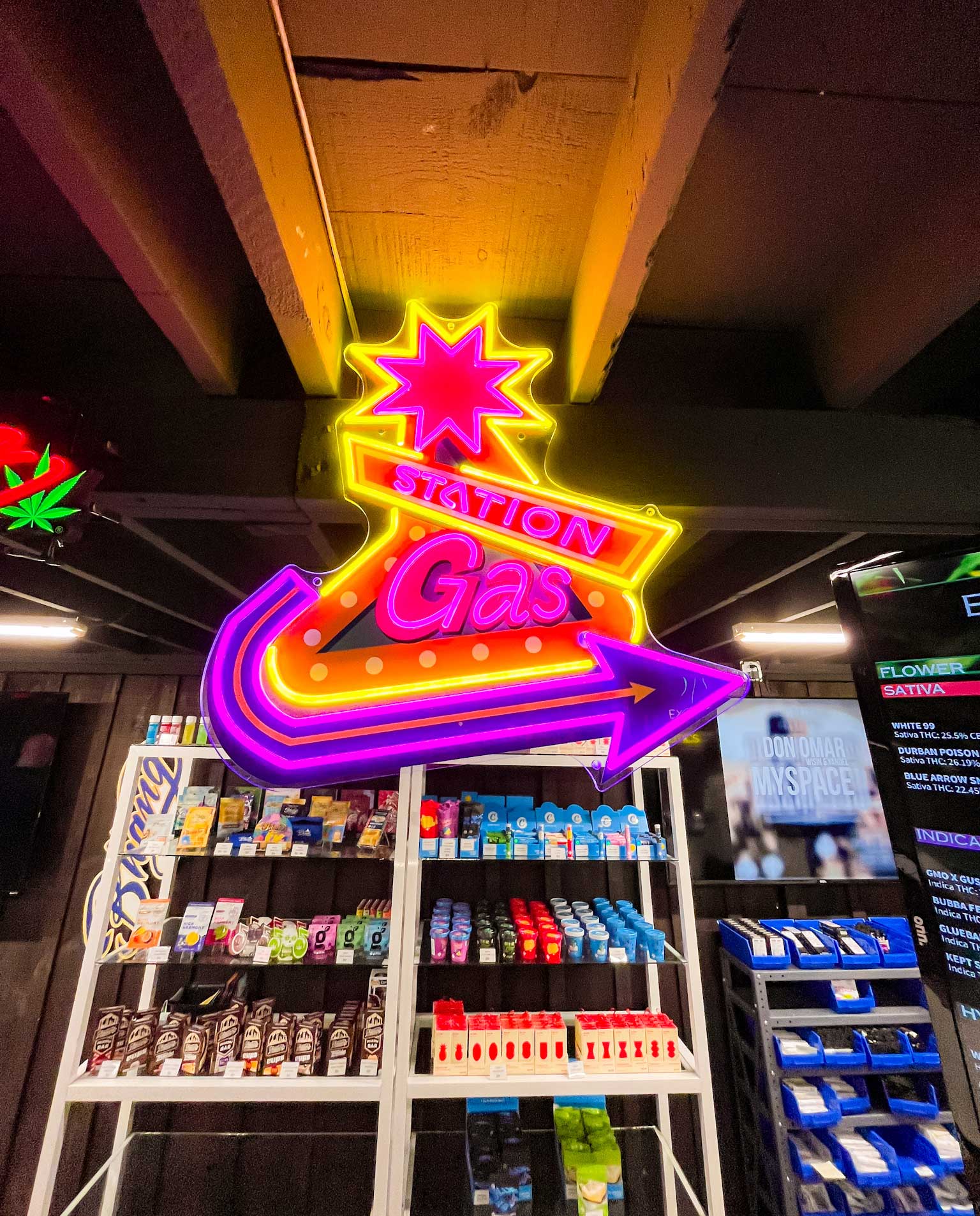 shop photo of Marijuana products and neon signs